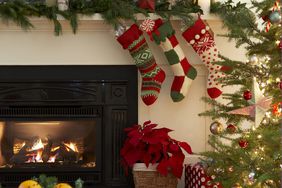 Fireplace with stockings and Christmas tree with gifts