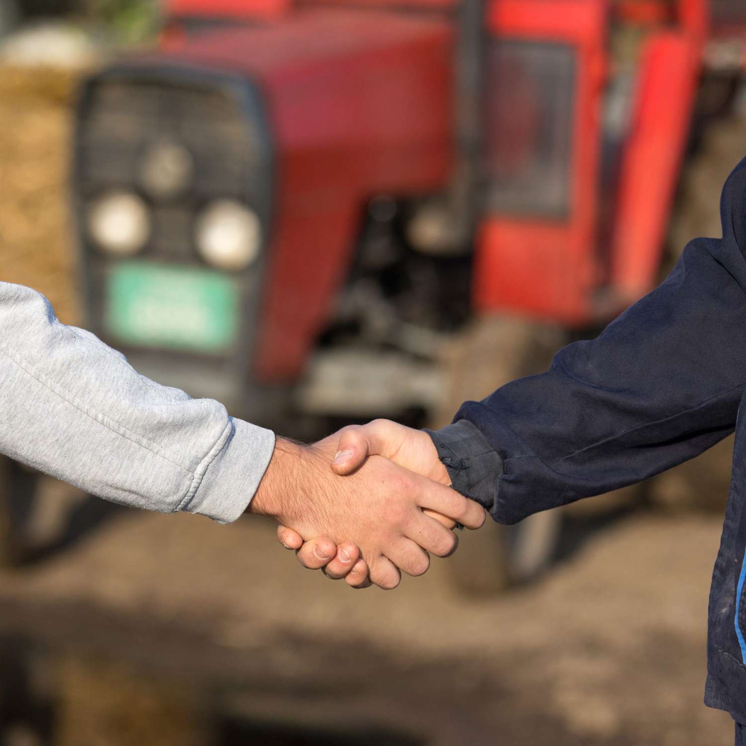 Two farmers shaking hands.