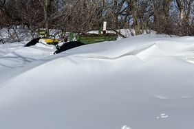 Nelsonâs venerable John Deere âAâ tractor was nearly buried by a snowdrift following a blizzard that arrived on March 17, 2023.